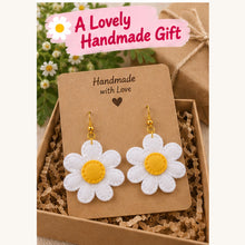 Finished felt daisy earrings presented as a handmade gift
