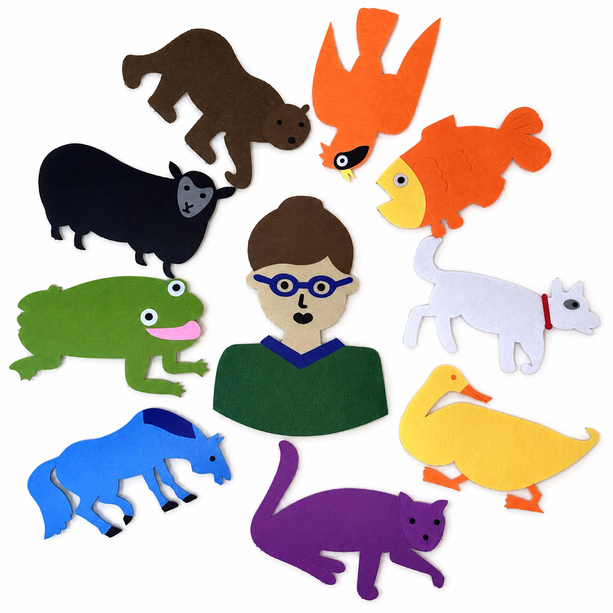 Colourful felt animals and a person arranged for a preschool storytelling activity