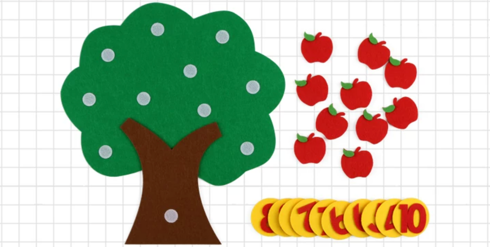 Flat lay of an unpopulated green felt apple tree activity set with 10 red felt apples and stacked yellow number tokens on a grid background.
